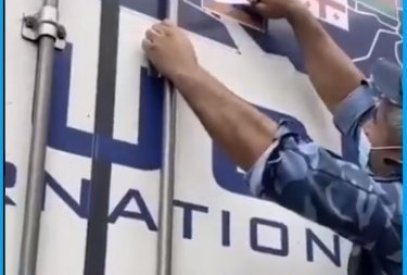 Did Azerbaijani police remove word ‘Armenia’ and Armenian flag off a lorry with a knife?
